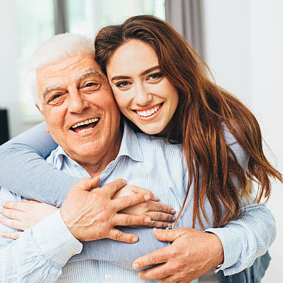 Beautiful woman with her father as they both smile